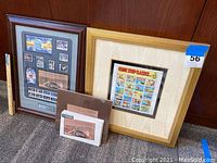 Wide shot including both framed stamp sets and two loose souvenir sheets showing overall items included