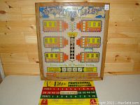Front view of 1956 Bowling Alley carnival game back glass with colorful vintage artwork and scoring windows.
