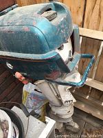 Faded green Johnson Sea-Horse 10 HP outboard motor showing overall wear and scratches