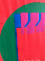 Close-up of pink and blue rectangular shapes against red and green background