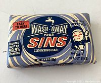 Close-up of the rectangular bar soap in its original vintage packaging showing branding and claims on the front.