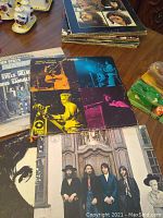 Photo showing a stack of vinyl album covers including Vanilla Fudge and The Beatles albums among others.