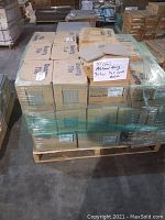 Full pallet stacked with 41 cartons of Ashanti Grey quarry tile and 3 cartons of top cove base tile wrapped in plastic.