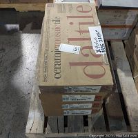 Four boxes of Daltile ceramic mosaic tiles stacked on a pallet, labeled D335 22MS1P.