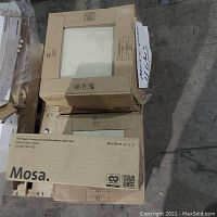 Four boxes of Mosa floor tiles on a pallet, labeled and in original packaging showing the Mosa brand and tile dimensions (30x30 cm).