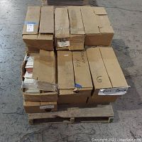 Stack of 14 cardboard cartons on a wooden pallet marked as Fire Brick tiles, showing condition of packaging and box labels.