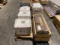 Pallet view showing stacked cases of Daltile and Urbatek boxes