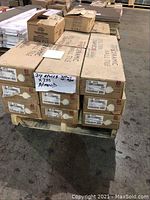 Pallet of 12 boxes labeled Daltile Ceramic Wall Tile