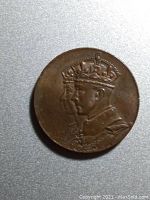 Obverse side showing the crowned profiles of King George V and Queen Victoria.