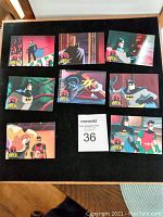 Card set displayed on black background showing eight cards laid out, featuring animated Batman and Robin scenes.