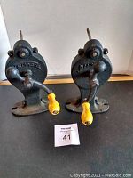 Front view of the two film winders with visible brand markings 'Kent-Made' and 'Noozie' and yellow wooden handles