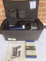 Meade ETX-60AT telescope in black M&P carrying case with instruction manual and National Audubon Society book displayed outside the case.