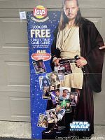 Front view of full six-foot tall cardboard stand up featuring Qui-Gon Jinn from Star Wars Episode 1 with Lay's branding and collectible game card promotion.
