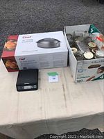 Photo showing the boxed Ciner 17" dome roaster, DYMO digital scale and a box of assorted mason jars on a table.