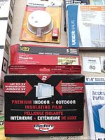 Photo showing Comfort Plus premium indoor and outdoor insulating film, Oberhaus window insulation kit, and other window insulation related items.