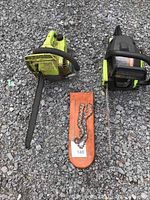Top view of two Poulan chainsaws on gravel, one with an orange bar cover and extra chain.