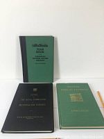 Front view of three books showing their covers: green and black Year Book Canadian Motion Picture Industry, black Report The Royal Commission Metropolitan Toronto, and green Pioneer Inns and Taverns by Edwin C. Guillet.