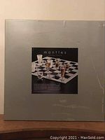 Box cover showing label for Mantles Bar None glass chess set with shot glasses