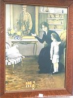Framed Mary Horsfall WWI print with woman, child, and soldier portrait in interior scene.