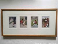 Full view of four framed vintage fairy tale illustrations in wooden frame