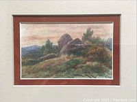 Frontal view of watercolor painting showing rural landscape with haystacks, double matting and beige wall background