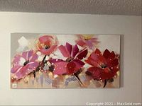 Flower painting on canvas showing large abstract flowers in bright colors