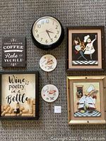 All six items arranged on carpet for display, including framed pictures, round clock, and decorative plaques