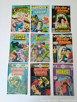 Front cover view of nine DC comic books from the 1970s including Superman, Justice League, Wonder Woman, Super Villains, Action Comics, Swamp Thing, and Man-Bat arranged in three rows of three.
