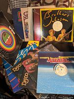 Photo showing various disco record covers including Brothers Johnson and other DJs' special promo and extended disco versions from late 70s collection.