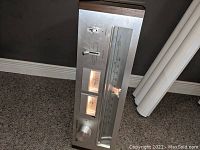 Pioneer TX-6700 AM/FM tuner resting on carpet showing front panel with signal meters and analog frequency display.