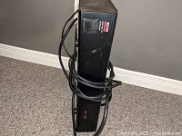 Side view showing the brand Adcom, model AC-515, and power switch.