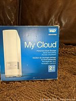 Photo of the blue and white retail box showing WD My Cloud branding and 2TB capacity.