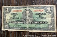 Front side of 1937 Bank of Canada one dollar note showing King George VI portrait and serial numbers.