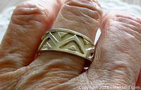 Sterling silver vintage modernist ring worn on finger showing geometric cut-out design and size fit.