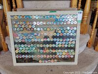 Front view of board featuring many colorful circular potato chip tokens depicting aircraft and space exploration.