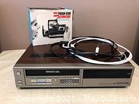 Front view of Panasonic VHS player with power cord on top