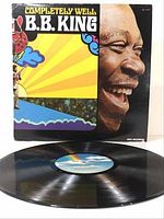 Front view of B.B. King "Completely Well" album cover and vinyl record displayed in front showing condition and label.