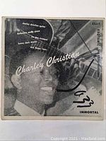 Front cover of Charley Christian ESJ-1 vinyl record showing black and white photo of Charley Christian with instrument and featured musicians text.