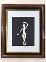 Frontal view of the vintage framed print showing the ballerina illustration and the wooden frame with gold inner border.