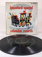 Vinyl record with original illustrated sleeve standing behind it showing 'Lunceford Special' and Columbia Records branding.