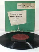 Photo of the vinyl record with original sleeve showing front cover.