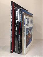 Five African modern art and photography books standing upright showing spines and covers