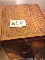 Top view highlighting the oak wood grain and size of the cabinet.