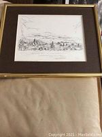 Full view of framed and matted print showing Lake Placid cityscape.