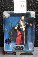 Front view of the sealed Star Wars Elite Series Chirrut Imwe figure in box showing figure and accessories clearly.