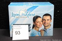 Front view of three sealed boxes of Lumi Glow Teeth Whitening tooth whitener, showing product branding and smiling man and woman images
