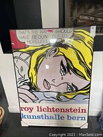 Frontal view of framed poster showing entire print and frame