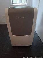 Front view of portable AC unit showing gray front panel and vents
