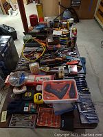 Top-down overview of table with assorted tools and accessories