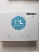 Box of IPL Hair Removal Device, showing branding and features such as 5 stage strength, contact sensor, dual mode flash